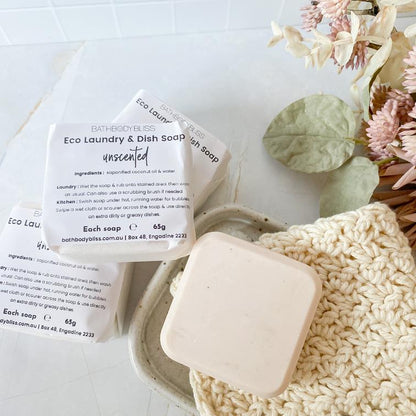 handmade-eco-friendly-vegan-stain-removing-laundry-soap-in-soapdish-angled-view-with-extra-wrapped-bars