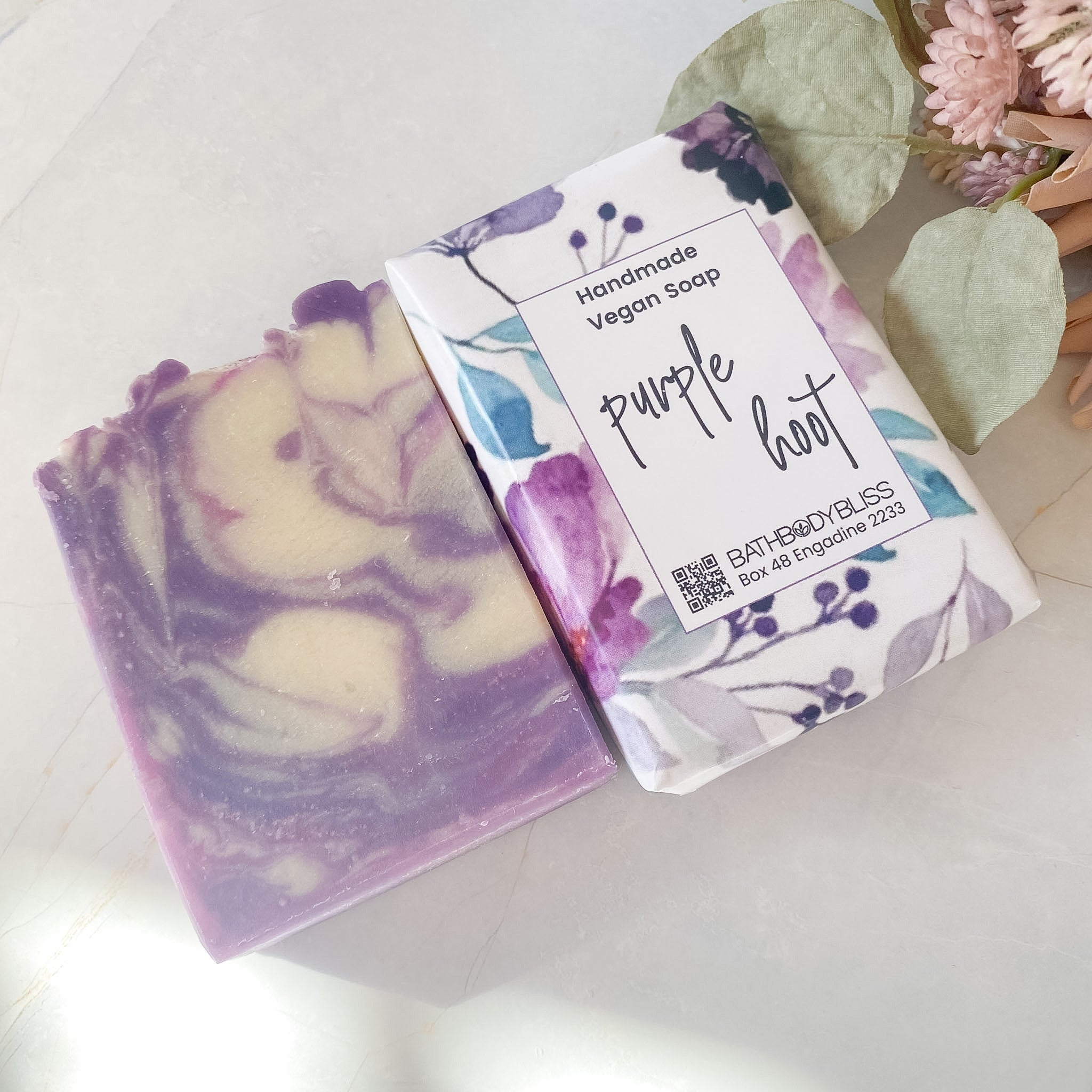 Handmade vegan soap with a decorative label on a light background