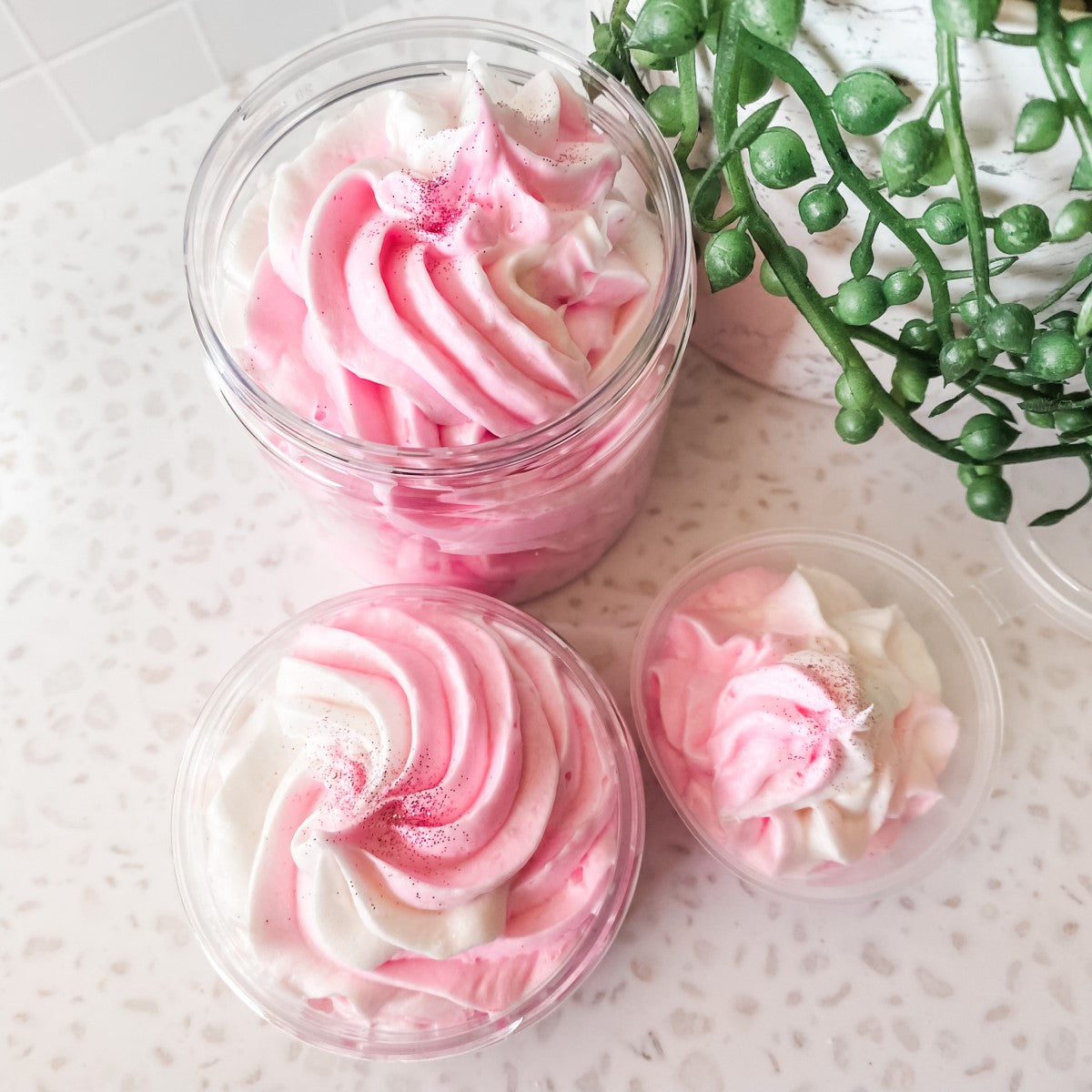 various-size-jars-of-handmade-whipped-soap-in-pink-and-white-swirls