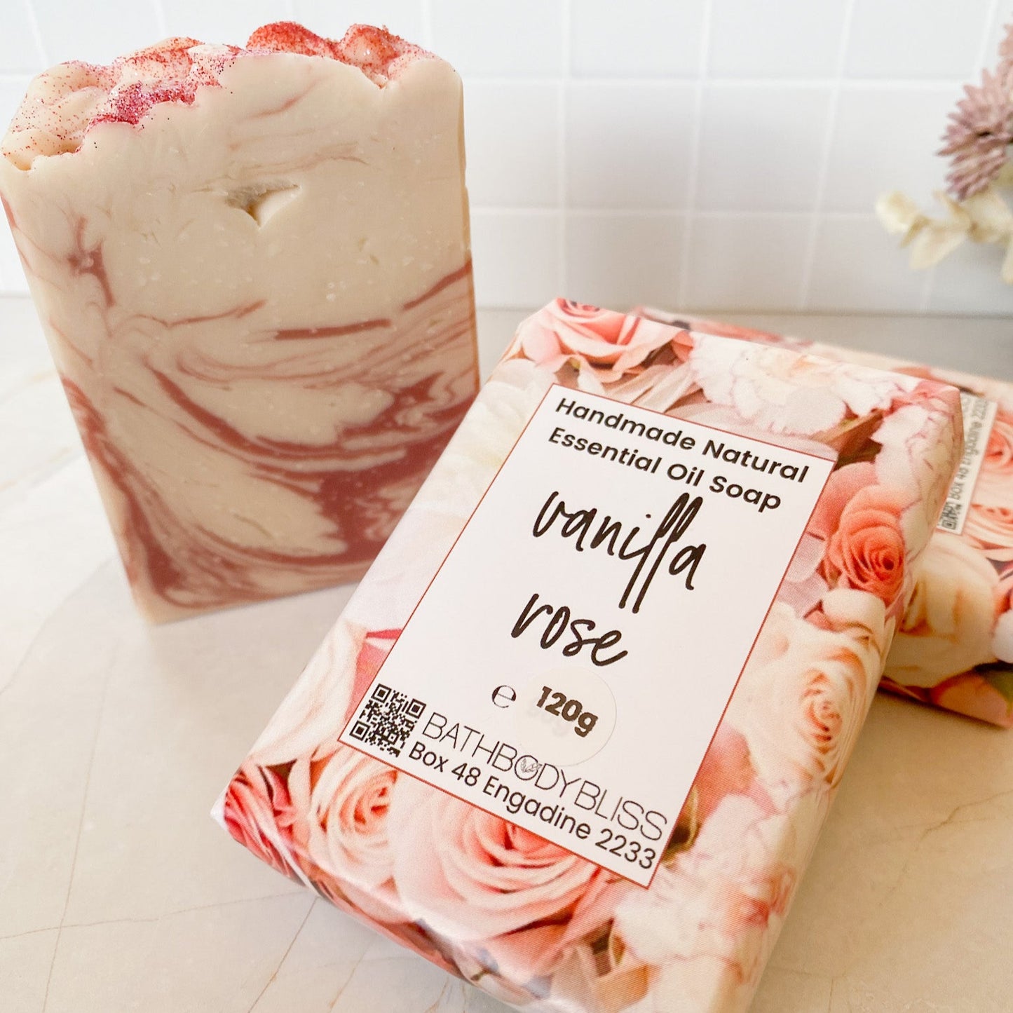 Vanilla Rose soap bar with packaging on a light background