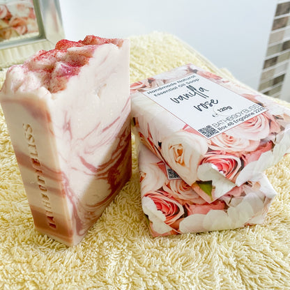 Bar of soap with floral packaging on a textured surface