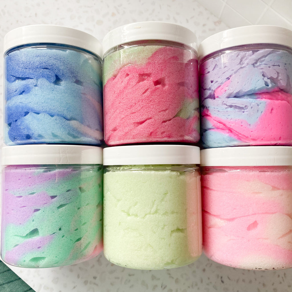 six jars of colourful body scrub