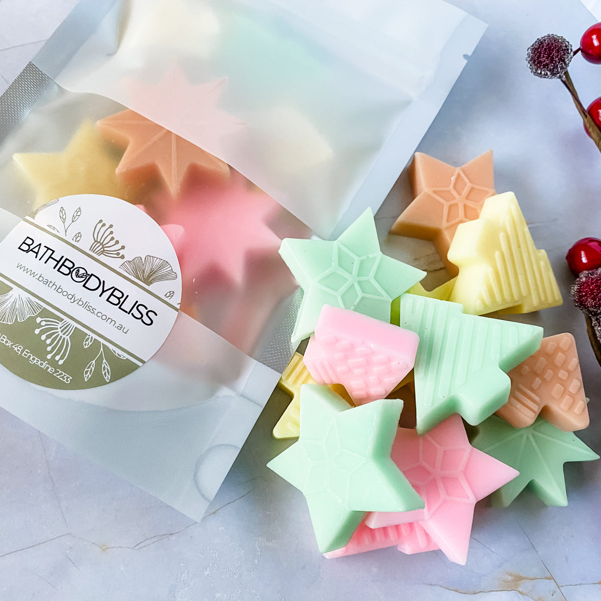 small star and christmas tree shaped soaps loose and packaged in bathbodybliss white and clear pouch