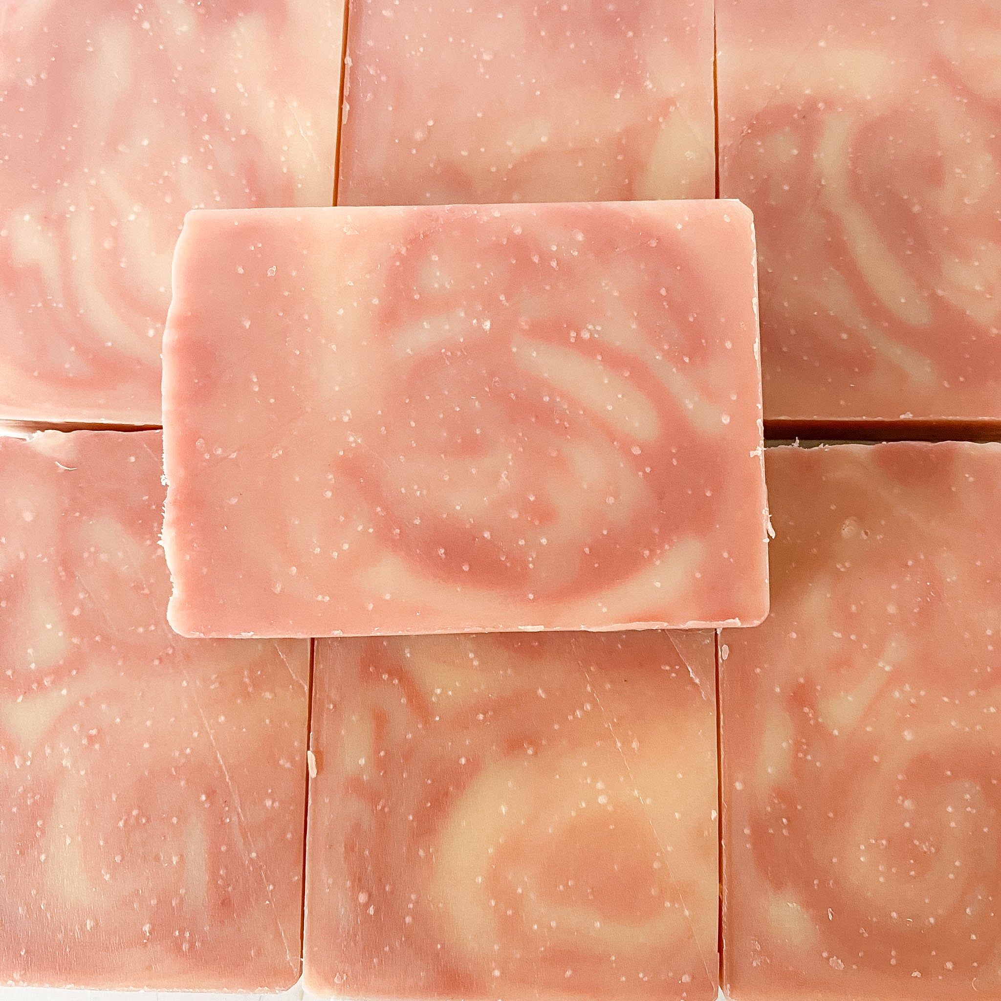 Pink soap bars with a swirling pattern 
